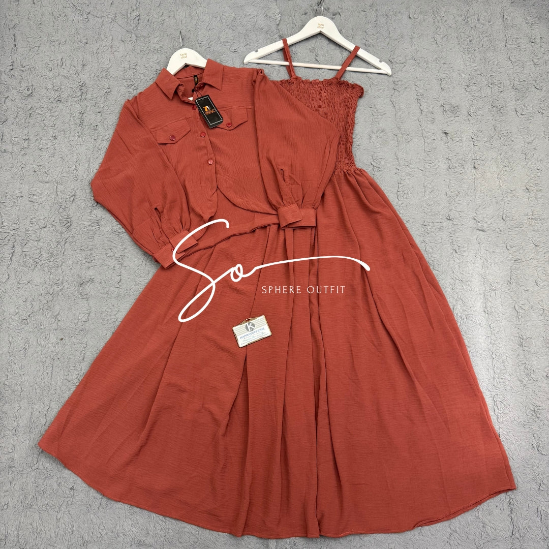 Elegant two-piece beige smocked maxi dress and matching collared jacket set on a hanger