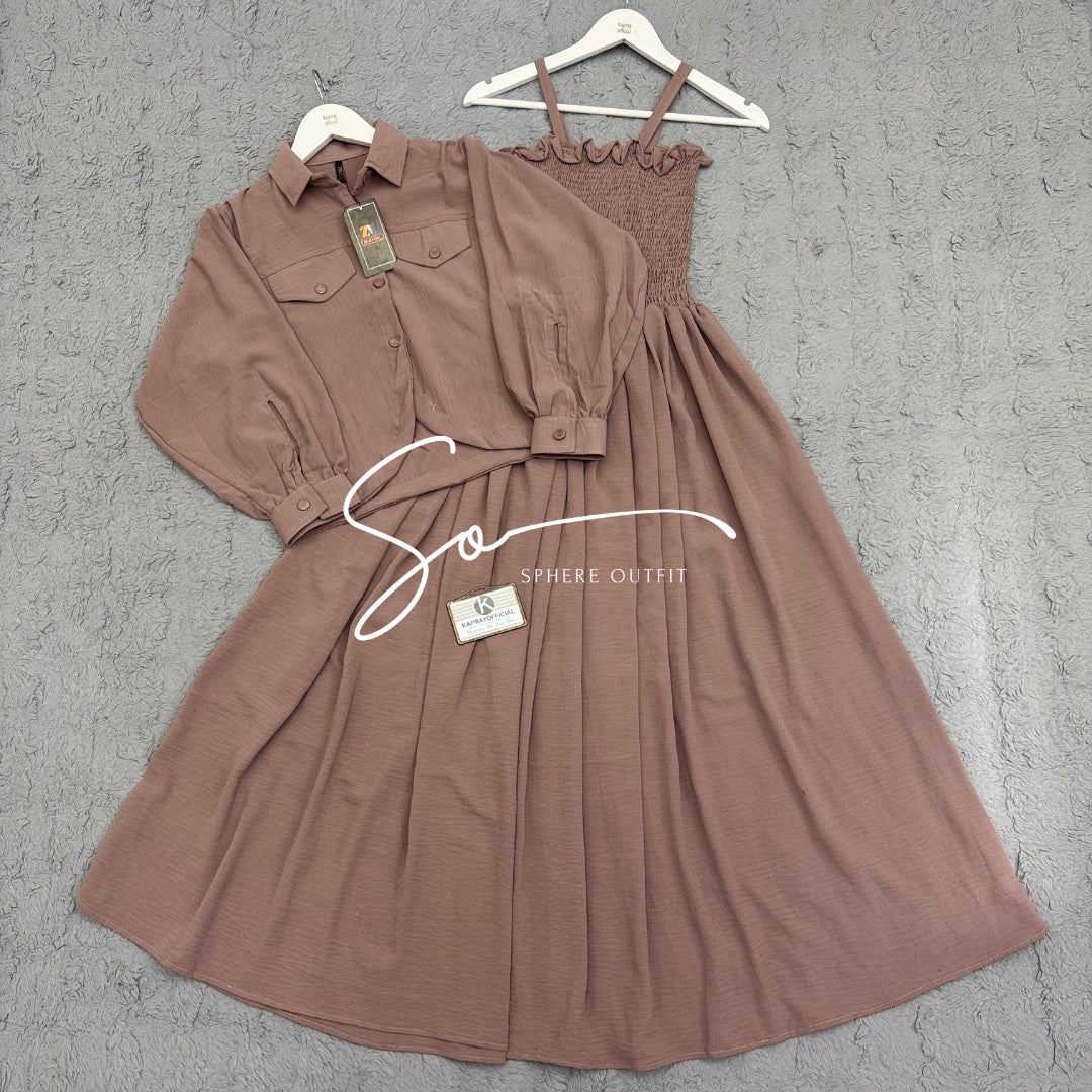 Elegant two-piece beige smocked maxi dress and matching collared jacket set on a hanger