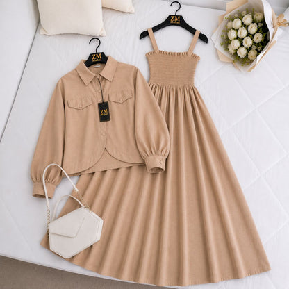 Beige shirt and dress set with a handbag on a white surface.