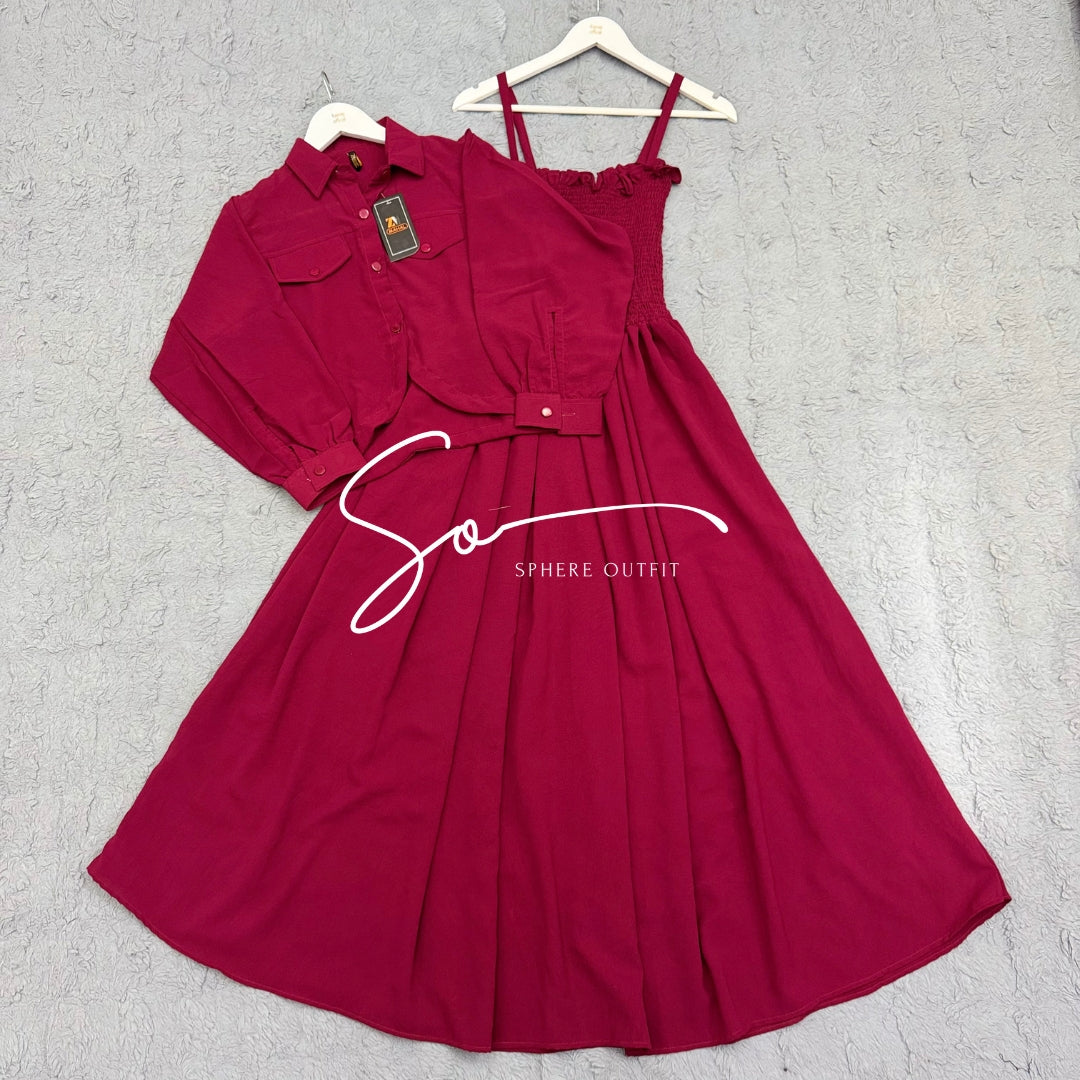 Elegant two-piece beige smocked maxi dress and matching collared jacket set on a hanger