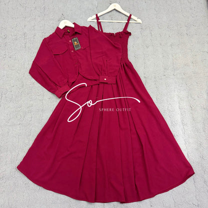 Elegant two-piece beige smocked maxi dress and matching collared jacket set on a hanger