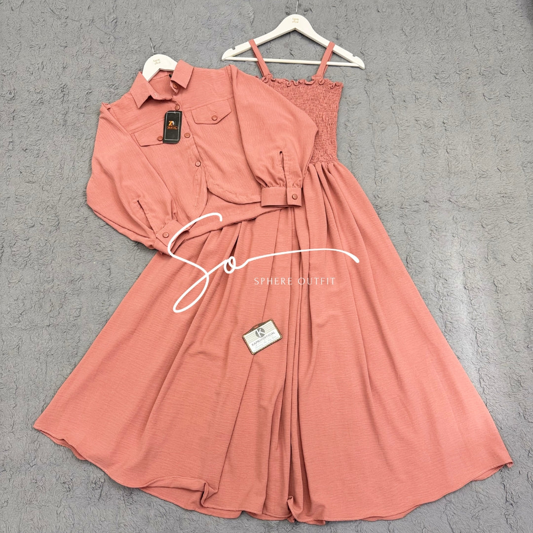 Elegant two-piece beige smocked maxi dress and matching collared jacket set on a hanger