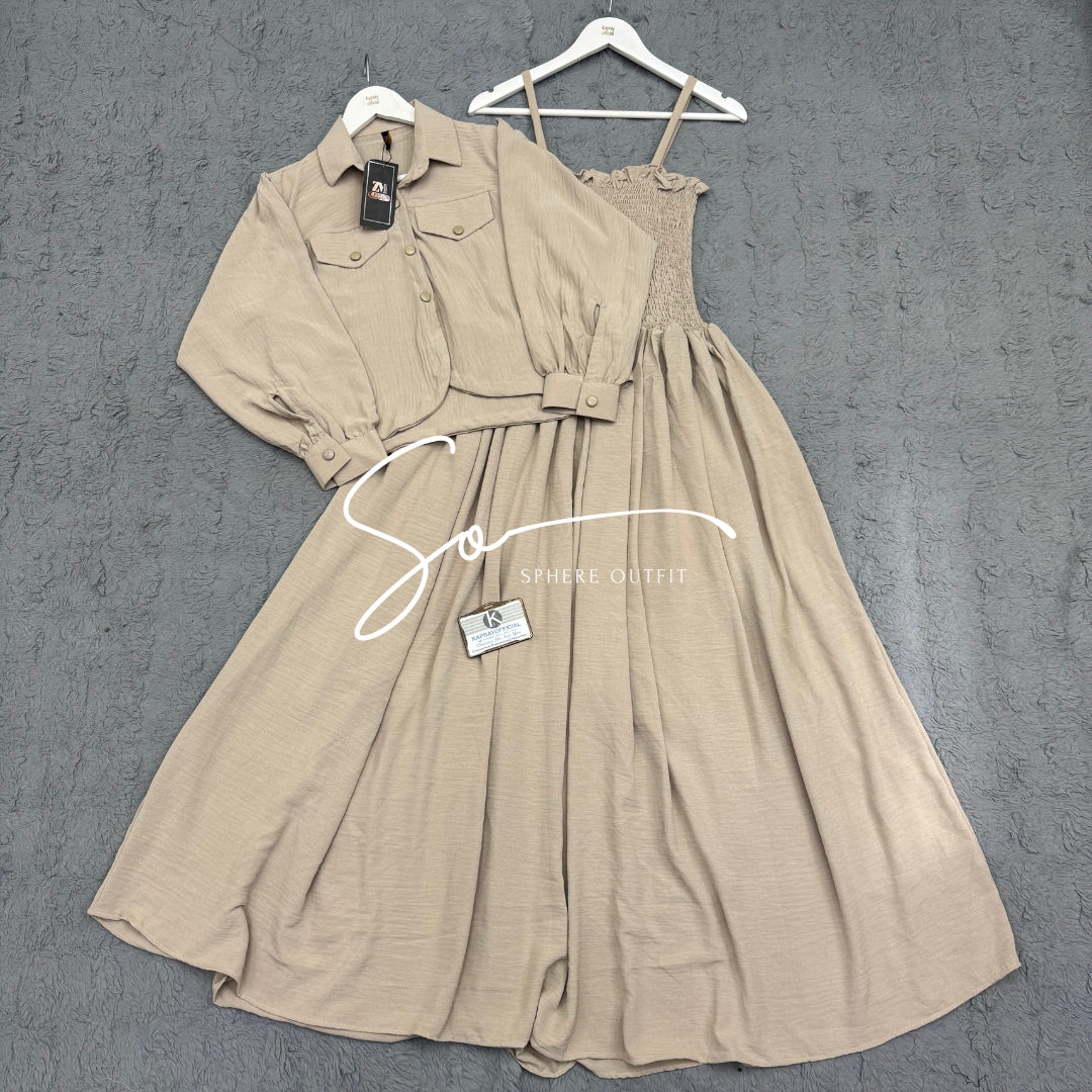 Elegant two-piece beige smocked maxi dress and matching collared jacket set on a hanger