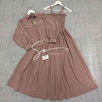 Elegant two-piece beige smocked maxi dress and matching collared jacket set on a hanger