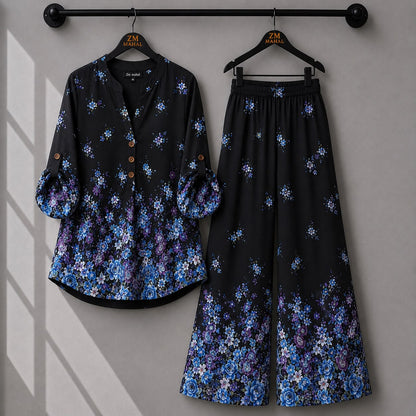Black floral co-ord set featuring blue rose print shirt and matching trousers.