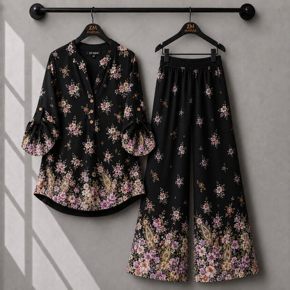 Black printed co-ord set featuring pink floral paisley design and relaxed fit trousers.