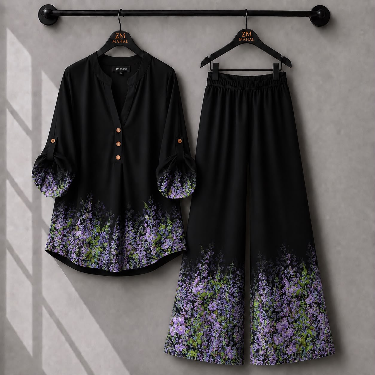 Black floral co-ord set with elegant purple flower print and comfortable wide-leg pants.